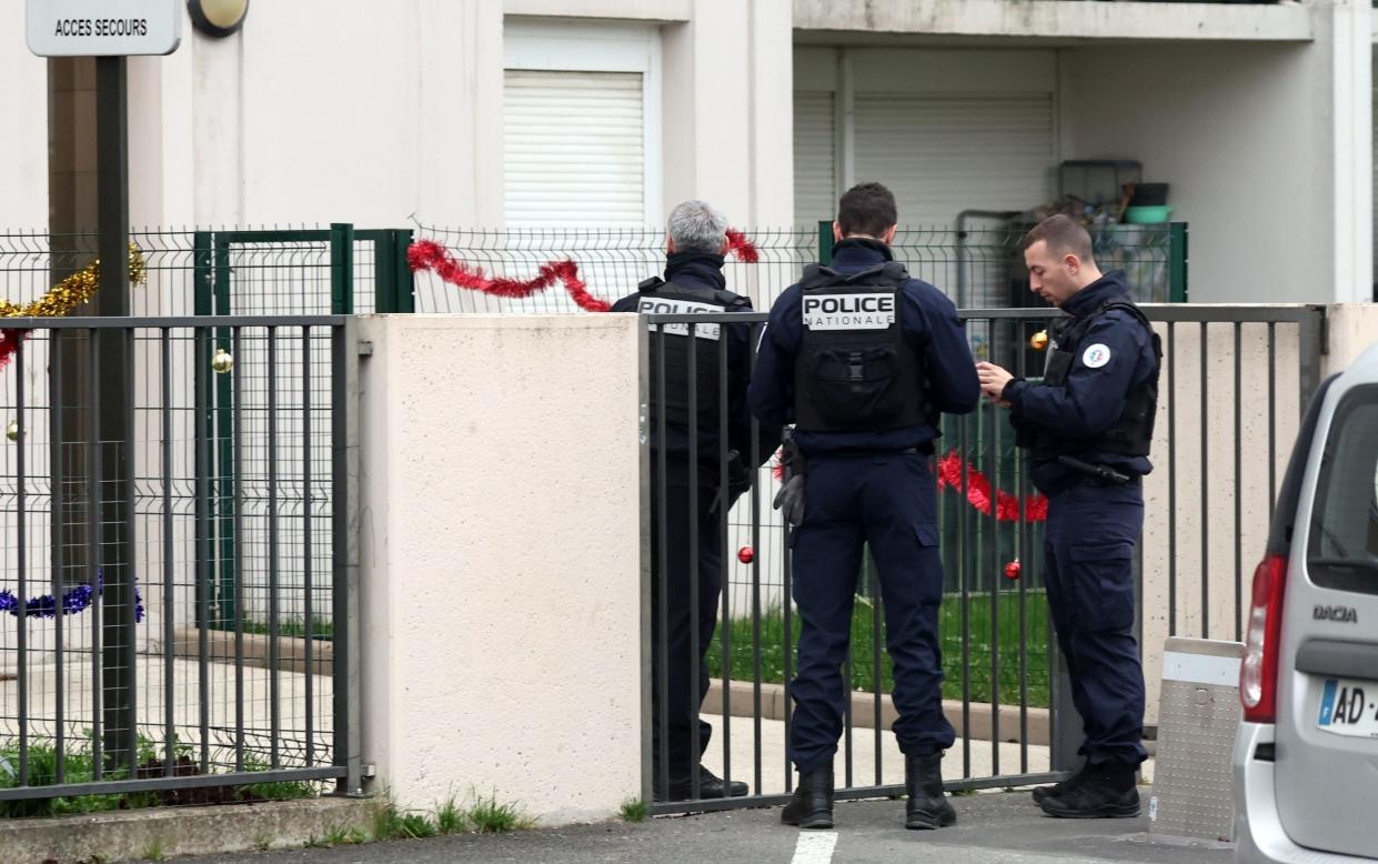 French police outside the building in Meaux, east of Paris, where five bodies were found