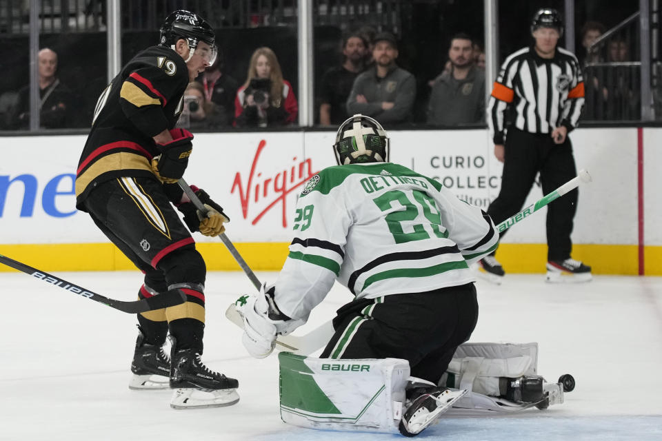 Dallas Stars goaltender Jake Oettinger (29) blocks a shot by Vegas Golden Knights right wing Reilly Smith (19) during the second period of an NHL hockey game Monday, Jan. 16, 2023, in Las Vegas. (AP Photo/John Locher)