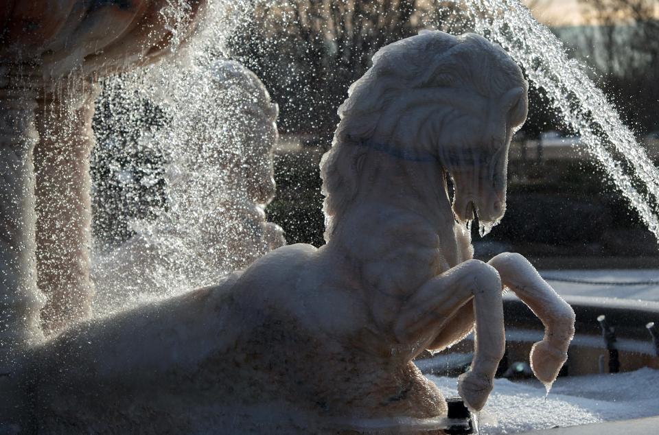 Although the fountain at Renaissance in Ridgeland, Miss., is still running, the four horses are encased in ice with icicles hanging off their features Tuesday, Jan. 16, 2023. A winter storm blew into the state Monday night, bringing frigid temperatures and frozen precipitation.