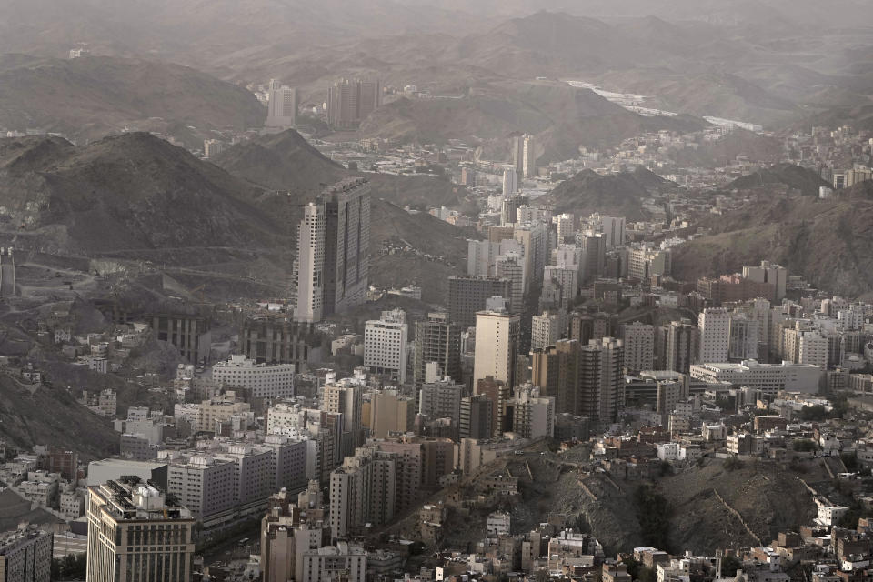 A general view shows the Muslim holy city of Mecca, Saudi Arabia, Thursday, June 22, 2023. Mecca is Islam's most sacred city and a focal point for the faith's followers. But it's also a place where around 2 million people live, work, and do everyday activities like laundry, grocery shopping, homework, putting the trash out, and paying the bills. Traffic, the population, and prices balloon during the peak Ramadan and Hajj seasons. (AP Photo/Amr Nabil)