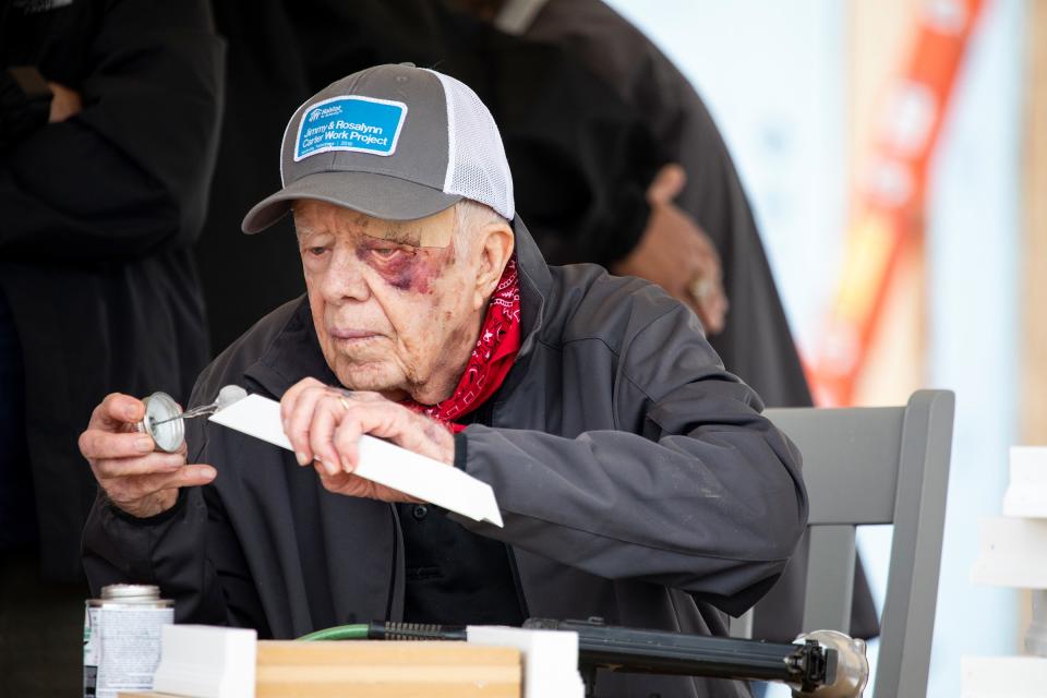 President Carter building a corbel at the Habitat volunteer project in Nashville, Tennesee, in 2019.