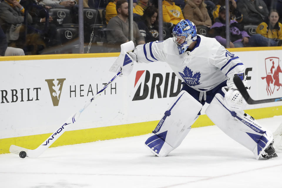 Toronto Maple Leafs goaltender Frederik Andersen, of Denmark, plays the puck in the second period of an NHL hockey game against the Nashville Predators Monday, Jan. 27, 2020, in Nashville, Tenn. (AP Photo/Mark Humphrey)