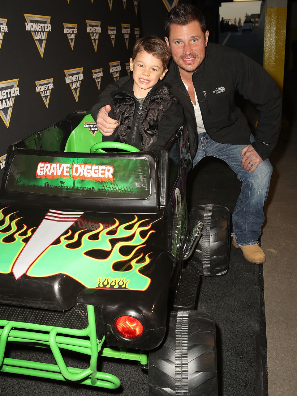 <p>Retired bar owner and perennial boybander Nick Lachey brought his eldest, Camden, for some father-son time. “Boys night!!” he wrote on Instagram. If he blinks a few times, his kiddo is going to be driving him around for real — though probably not in a vehicle that says “Grave Digger” across the front of it. (Photo: Ari Perilstein/Getty Images for Feld Entertainment) </p>