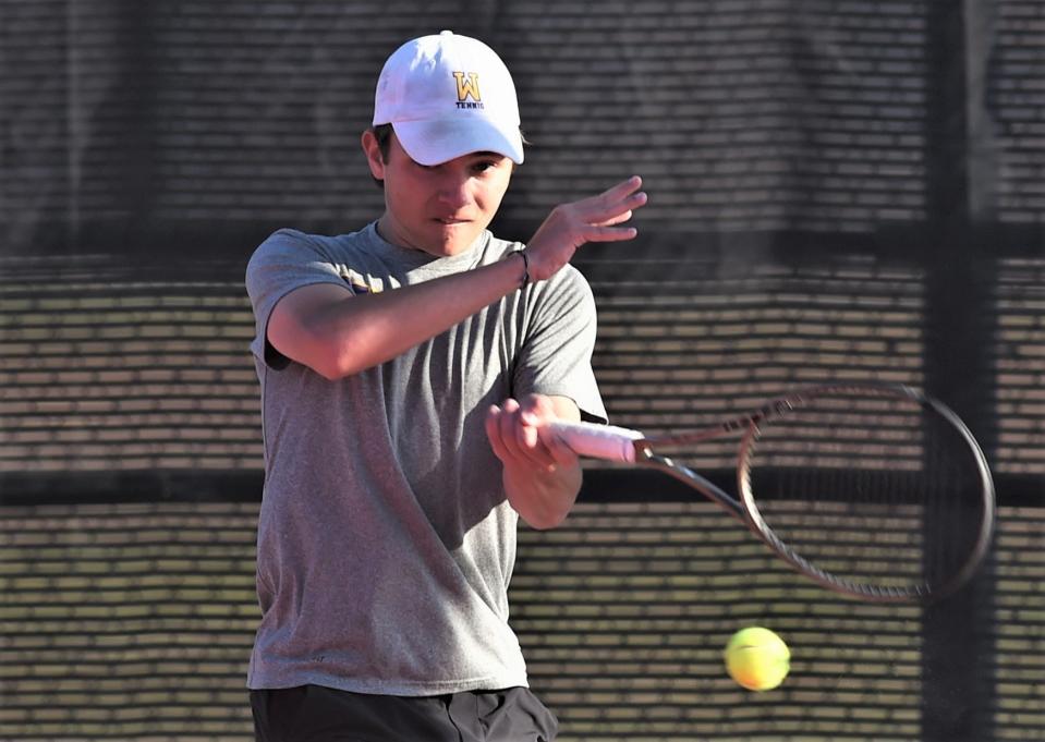 Wylie's Connor Brown returns a shot during his boys doubles match with teammate Grant Bristow at the Region I-5A tournament Tuesday, April 11, 2023, in Lubbock.