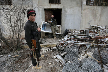 Turkish-backed Free Syrian Army fighters are seen after Free Syrian Army forces took control of Kafr Jana village north of Afrin, March 7. REUTERS/Khalil Ashawi