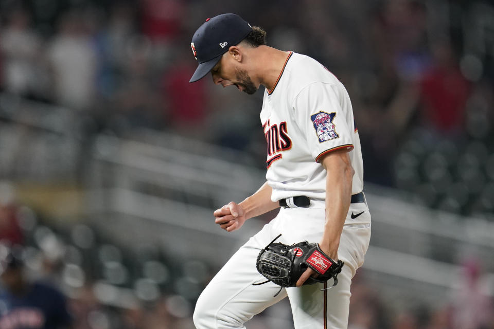 Minnesota Twins relief pitcher Jorge Lopez celebrates after forcing the final out to defeat the Boston Red Sox 4-2 of a baseball game Monday, Aug. 29, 2022, in Minneapolis. (AP Photo/Abbie Parr)