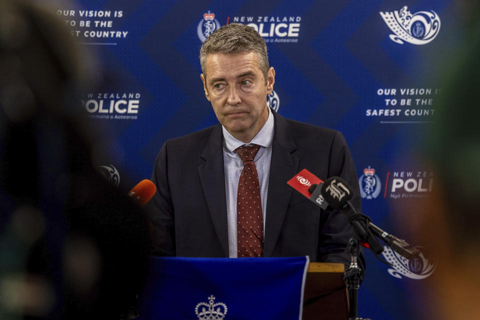 Acting Detective Inspector Andrew Saunders gives a media update on the search for Tom Phillips and his children, including the introduction of a NZ$80,000 (US$49,000) reward in Hamilton, New Zealand, Tuesday, June 11, 2024. New Zealand authorities offered a reward and immunity from prosecution Tuesday to anyone who can help their search for three children who have been missing since their father vanished with them from a remote rural community more than two years ago. (Mike Scott/New Zealand Herald via AP)