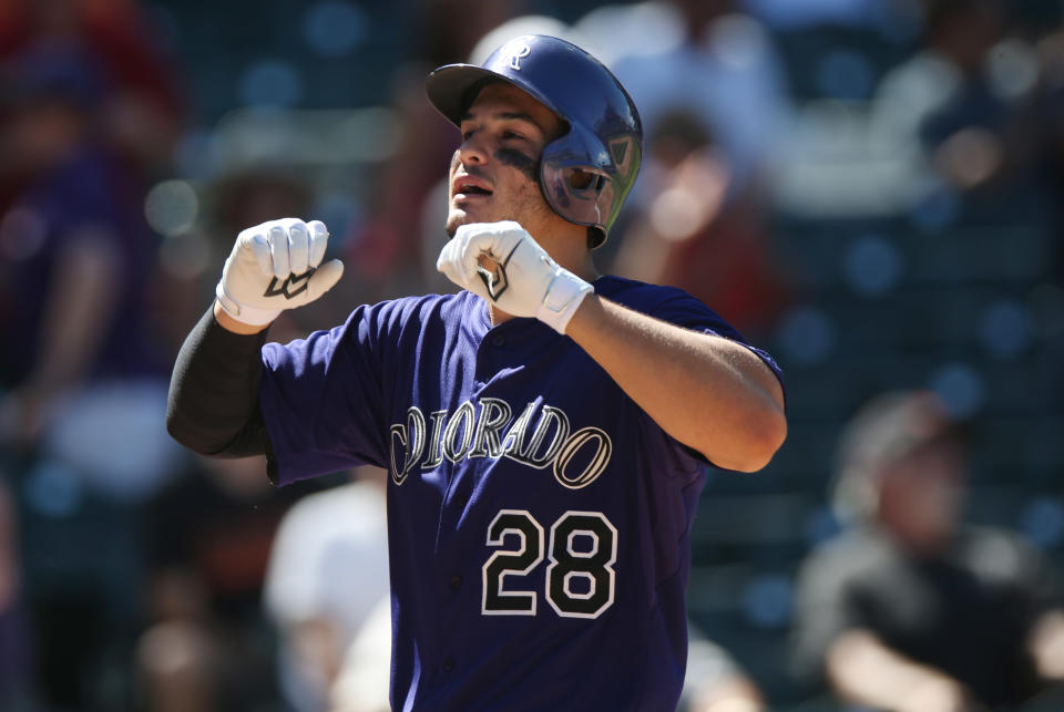 Nolan Arenado, clearing bases. (AP Photo/David Zalubowski)