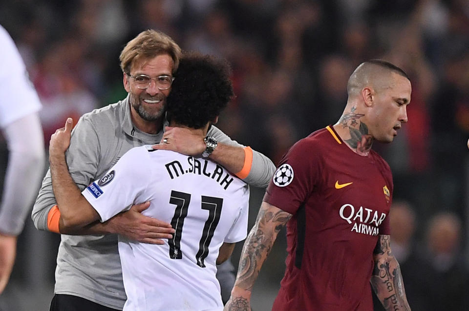 <p>Soccer Football – Champions League Semi Final Second Leg – AS Roma v Liverpool – Stadio Olimpico, Rome, Italy – May 2, 2018 Liverpool manager Juergen Klopp celebrates after the match with Mohamed Salah as Roma’s Radja Nainggolan looks dejected REUTERS/Alberto Lingria </p>