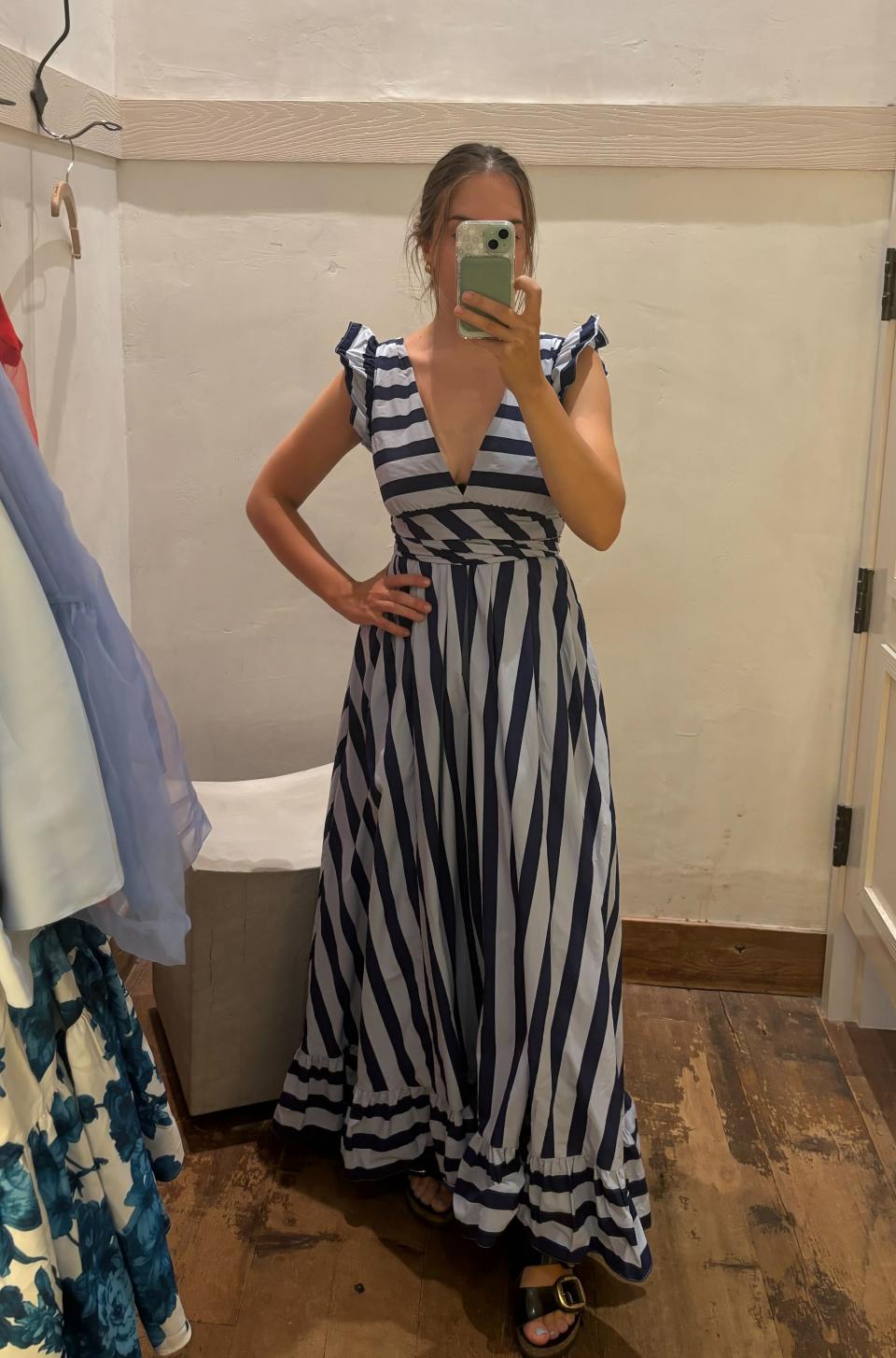 woman wearing blue striped maxi dress 