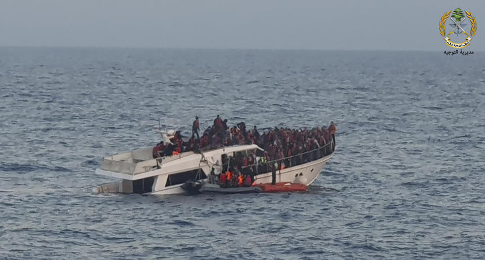 File In this photo released by the Lebanese Army, shows Lebanese army on their dinghy, rescuing migrants from a boat sinking in the Mediterranean Sea, near the shores of Tripoli, north Lebanon, Saturday, Dec. 31, 2022. A short Lebanese army statement said the vessel was carrying people "who were trying to illegally leave Lebanon's territorial waters." It said three Lebanese navy boats and one from the U.N. peacekeeping force in Lebanon, known as UNIFIL, were rescuing the approximately 200 migrants. (Lebanese Army Website via AP, File)