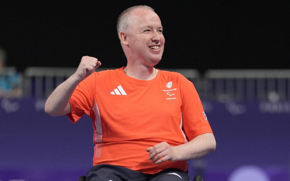 Stephen McGuire celebrates winning boccia gold