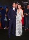 <p>Michelle Wiliams and Tom Hardy proved they scrub up well for the premiere of new film ‘Venom’. Williams shimmered in a Louis Vuitton dress while Hardy dressed in a pinstripe suit. <em>[Photo: Getty]</em> </p>