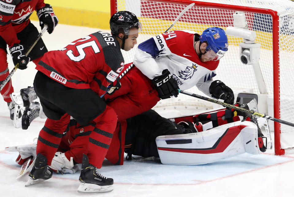 Czech Republic's Radek Faksa falls down on top of Canada's goaltender Matt Murray during the Ice Hockey World Championships semifinal match between Canada and Czech Republic at the Ondrej Nepela Arena in Bratislava, Slovakia, Saturday, May 25, 2019. (AP Photo/Petr David Josek)