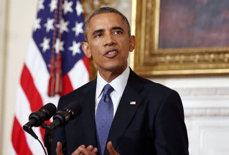 U.S. President Barack Obama talks about the humanitarian relief situation in Iraq, at the State Dining Room of the White House in Washington August 7, 2014. REUTERS/Larry Downing