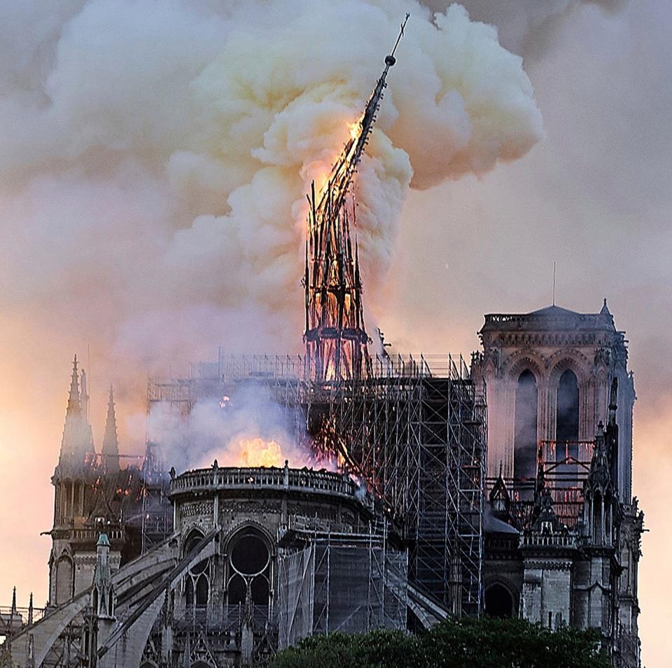 The spire at Notre-Dame collapses during a huge blaze in 2019