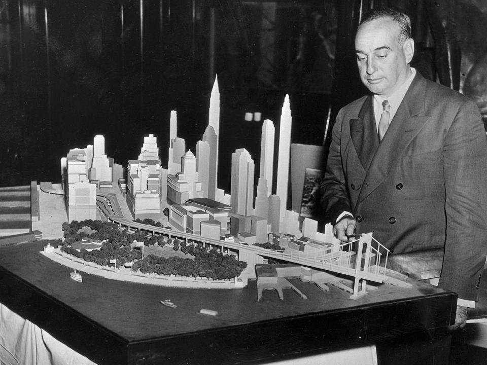 New York City Park Commissioner Robert Moses is shown in 1939 with the model of the lower end of Manhattan and the bridge with which it is proposed to connect Battery Park with Brooklyn. Opponents of the $40,000,000 project was in favor of a tunnel under the East River. / Credit: Bettmann/Getty Images