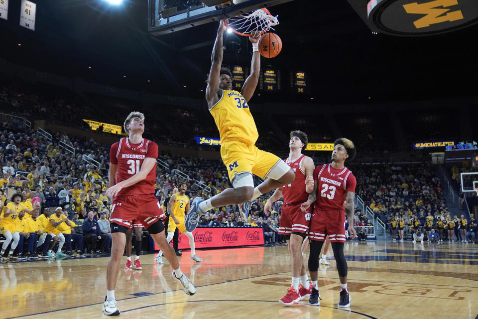 Michigan Wolverines forward Tarris Reed Jr. (32) dunks against Wisconsin in the second half of an NCAA college basketball game in Ann Arbor, Mich., Wednesday, Feb. 7, 2024. (AP Photo/Paul Sancya)