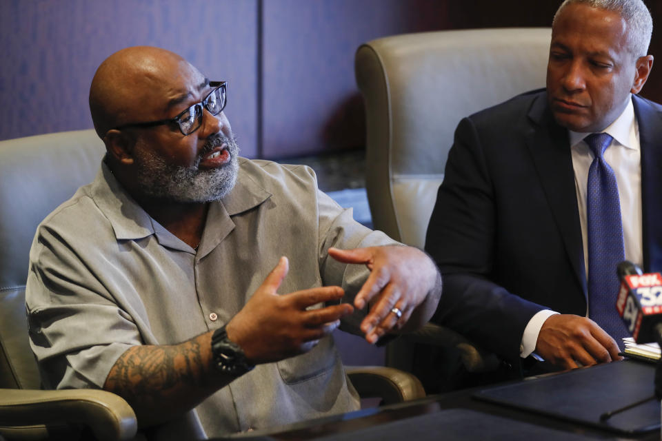 Veldarin Jackson, Sr., left, talks about his deceased mother, Janice Reed, Tuesday, May 24, 2022, in Chicago. Reed was one of the three senior victims who died in a Rogers Park building where residents complained of heat. The Cook County Medical Examiner's office has yet to determine the causes of death for the three women on May 14. (Jose M. Osorio/Chicago Tribune via AP)