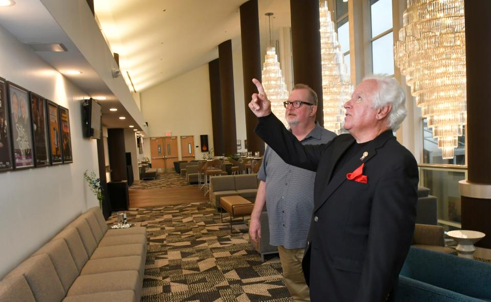 Anthony Catanese (right), who chairs the King Center board of directors, points out renovations with General Manager Bob Papke on the upper floor of the performing arts venue.