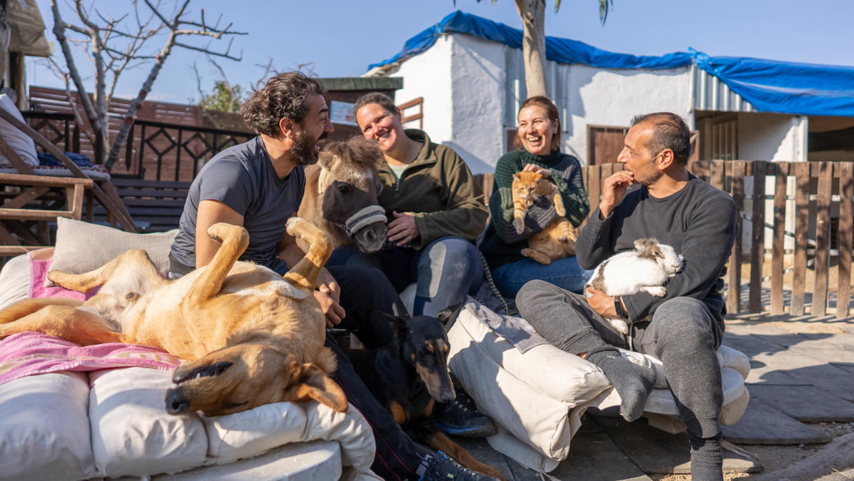 Group of people with assorted animals