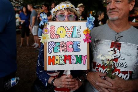 People take part in a vigil for the Pulse night club victims following last week's shooting in Orlando, Florida, U.S., June 19, 2016. REUTERS/Carlo Allegri