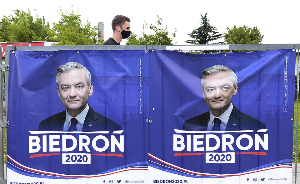 An electoral poster for left-wing candidate Robert Biedron is seen, in Warsaw, Poland, Tuesday, June 23, 2020. Biedron, who is openly gay, is currently at below 10% in the polls for Sunday's presidential election. (AP Photo/Czarek Sokolowski)