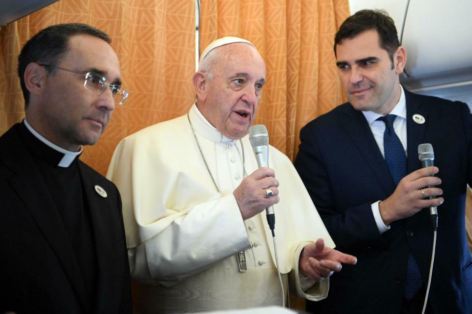 Pope Francis greets reporters during his flight from Rome, Italy, to Sofia, Bulgaria, Sunday, May 5, 2019. Pope Francis is paying a three day visit to Bulgaria and North Macedonia in his 29th Apostolic Journey abroad. (Maurizio Brambatti/Pool via AP)