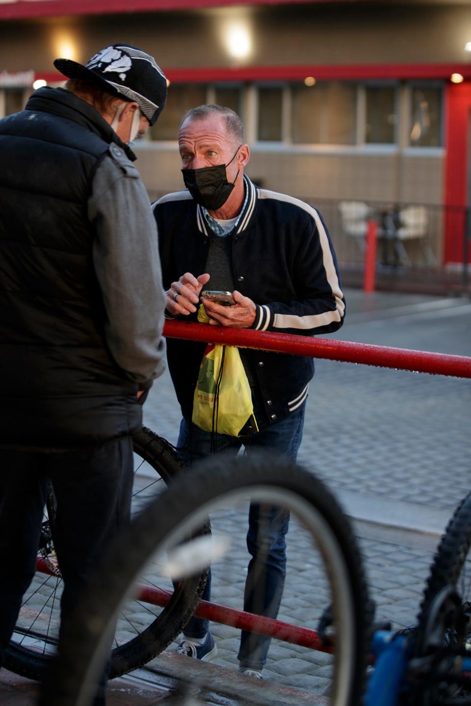 Riverside County policy advisor Greg Rodriguez, right, surveys Ryan Jones, 31, during the annual Riverside County point-in-time homeless count in Palm Springs, Calif., on Wednesday, Feb. 23, 2022.