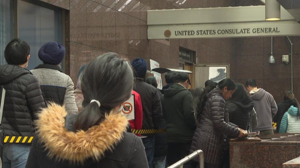 People line up outside the U.S. Consulate in Vancouver on Friday morning, as the U.S. State Department estimates nearly 2.5-year wait times for booking U.S. visitor visa interviews in the city.