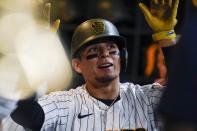 Milwaukee Brewers' Luis Urias celebrates after hitting a home run during the fifth inning of a baseball game against the Washington Nationals Saturday, May 21, 2022, in Milwaukee. (AP Photo/Morry Gash)