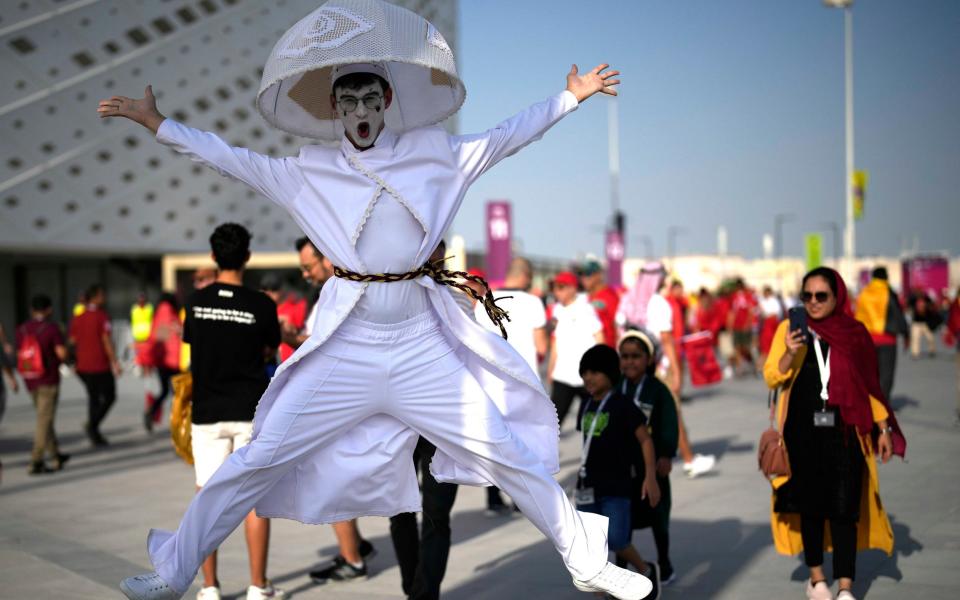 A fan jumps up prior to the World Cup group F soccer match between Belgium and Morocco, at the Al Thumama Stadium in Doha - AP