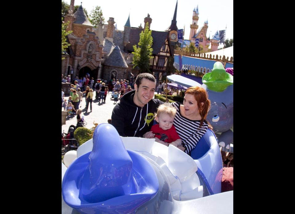 Pete Wentz, Ashlee Simpson and their son, 11 month old Bronx Mowgli Wentz, ride Dumbo Flying Elephants at Disneyland on October 29, 2009 in Anaheim, California.  This was Bronx Mowgli's first ride on his first-ever trip to Disneyland.      (Photo by Paul Hiffmeyer/Disney via Getty Images)