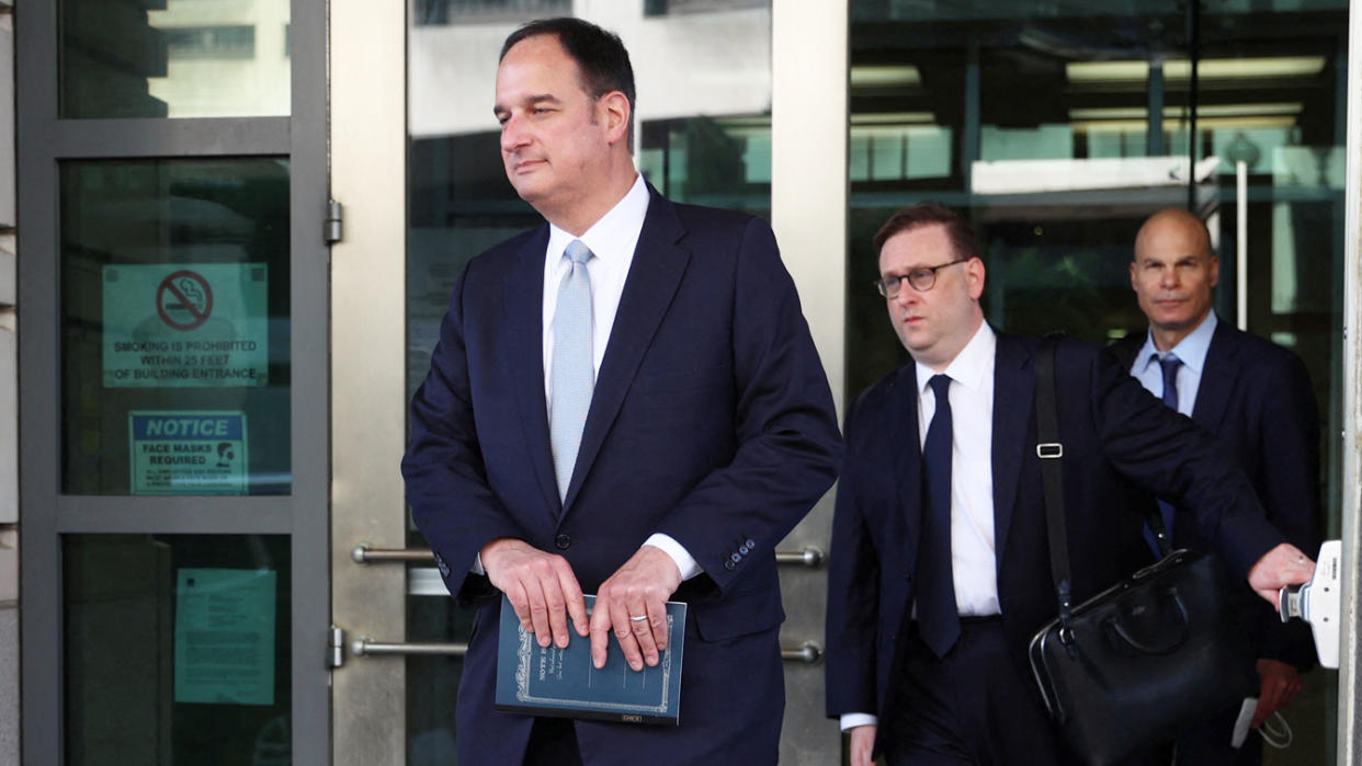 Attorney Michael Sussmann departs a federal courthouse.