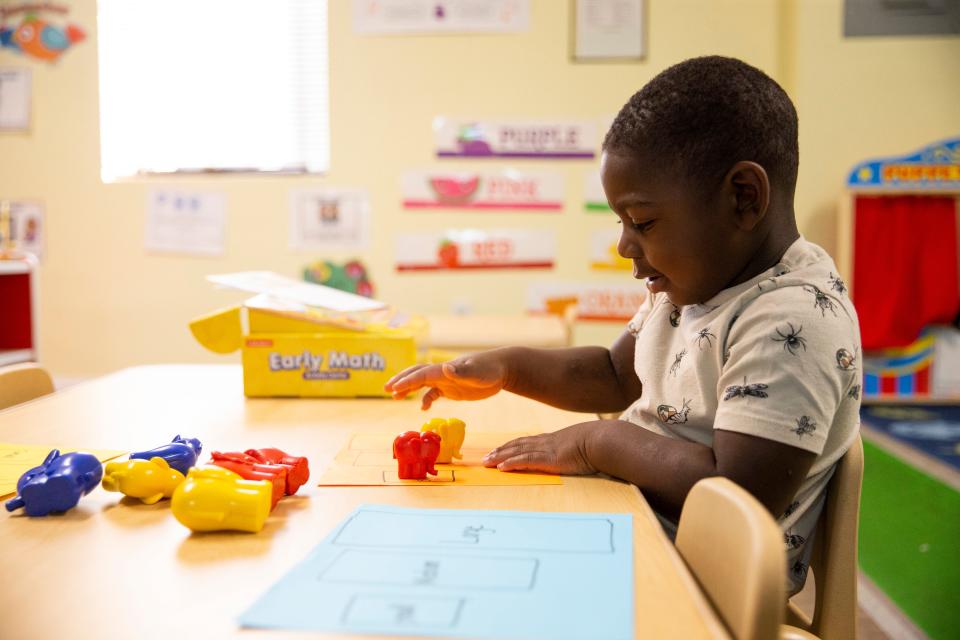 Dallas, 3, tries to match different sized elephant toys to either a small, medium or large box on a piece of paper while learning about sizes at one of the learning centers during the Equity to Prosperity program in Memphis, Tenn., on Thursday, September 7, 2023.
