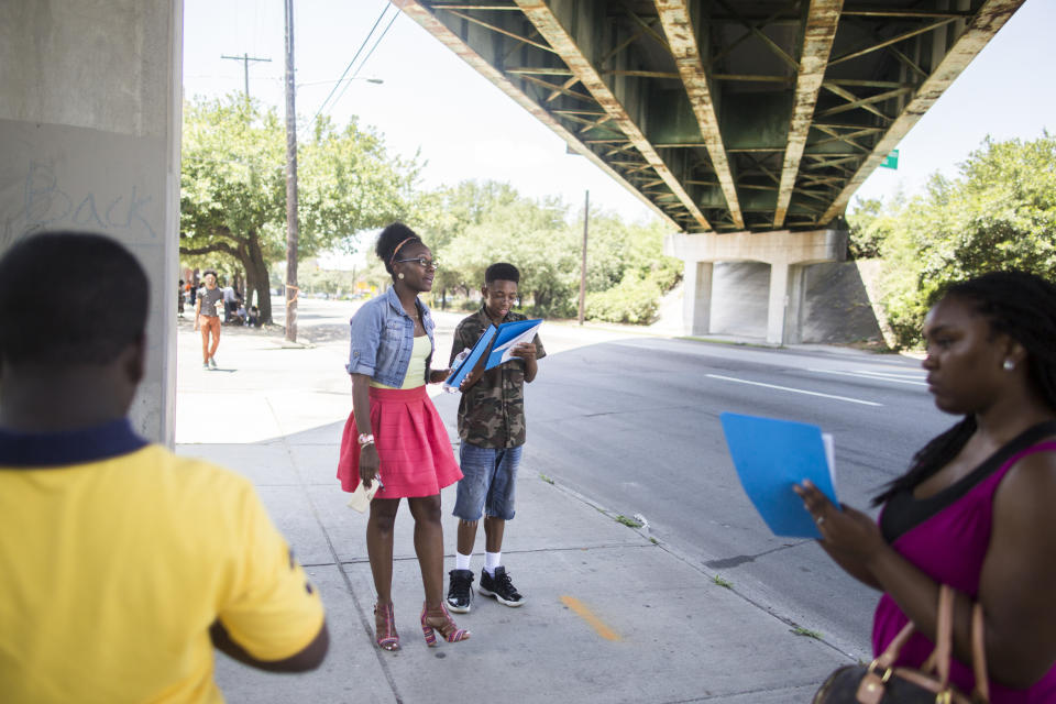 In June 4, 2016 photo provided by Deep Center, Deep Center artists observe how people interact with the space around and under the I-16 overpass in Savannah, Ga. Deep Center works with young writers to share their stories with policy makers, judges, politicians, police officers and the like.(Linneah Anders/Deep Center via AP)