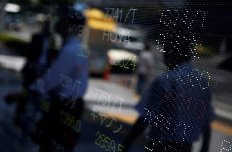 Share price of Japan's Nintendo Co. (R) is displayed at a stock quotation board outside a brokerage in Tokyo, Japan July 11, 2016. REUTERS/Issei Kato/File Photo /File Photo