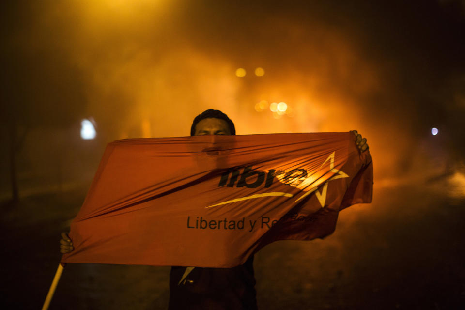 <p>Supporters of presidential candidate Salvador Nasralla chant slogans against Honduran President Juan Orlando Hernandez, who’s running for reelection, as they protest what they call electoral fraud in Tegucigalpa, Honduras, Thursday, Nov. 30, 2017. (Photo: Rodrigo Abd/AP) </p>