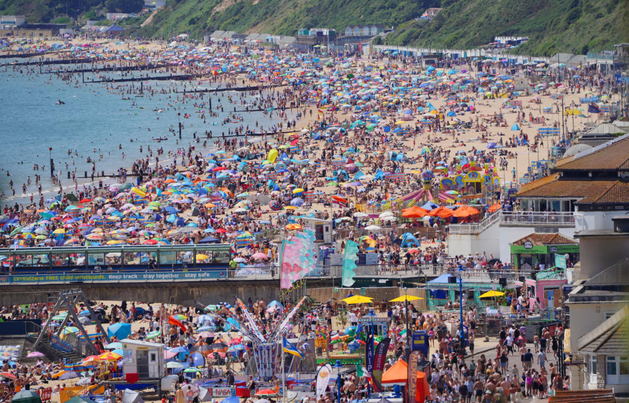 File photo dated 17/07/21 of people enjoying the weather on Bournemouth beach in Dorset. Humans are unequivocally driving global warming - with impacts from heatwaves to rising seas and extreme rain already seen around the world, a new UN report warns. Issue date: Monday August 9, 2021.