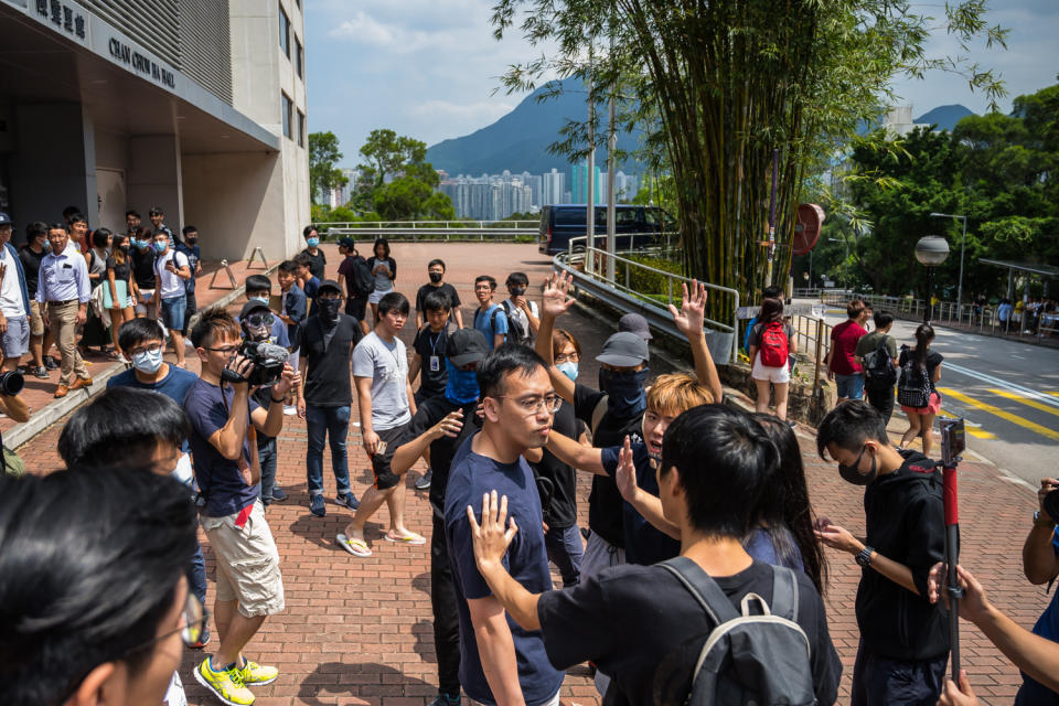 Students argue with a Chinese exchange student as they occupy a canteen at the Chinese University of Hong Kong on September 23, 2019 in Hong Kong, China. | Billy H.C. Kwok—Getty Images