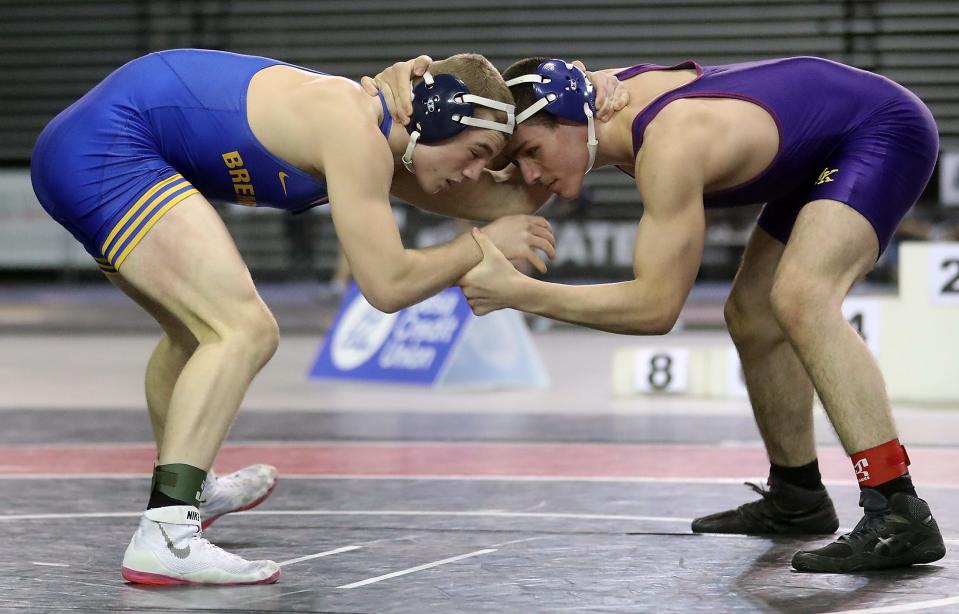 Bremerton's Lars Michaelson wrestles North Kitsap's Zakaria Hammou for the 170-pound championship bout at Mat Classic State on Saturday, Feb. 19, 2022.