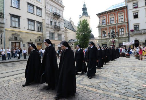 Nuns of the Ukrainian Orthodox Greek Catholic Church (UOGCC) stage a protest in Lviv on June 10. The Euro 2012 football tournament is providing the perfect platform to air a range of local and national grievances in the former Soviet state. The day after Germany's 1-0 victory over Portugal, it was the turn of the nuns as well as purists of the Ukrainian language to demonstrate