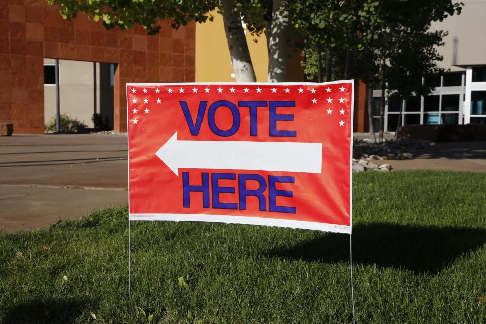 A "vote here" sign sits on June 4 in front of the Farmington Public Library at 2101 Farmington Ave.