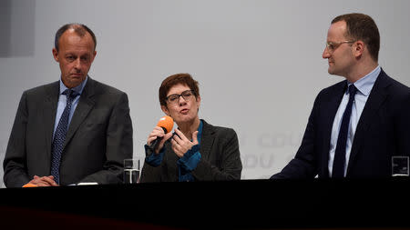 Christian Democratic Union (CDU) candidates Friedrich Merz, Annegret Kramp-Karrenbauer and Jens Spahn attend a regional conference in Luebeck, Germany, November 15, 2018. REUTERS/Fabian Bimmer