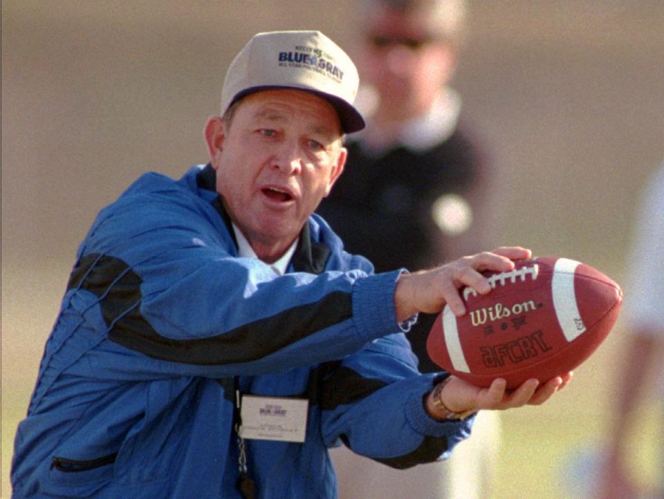 Former Memphis coach Chuck Stobart works with the Gray squad defense during practice for the Blue-Gray All Star Classic in Montgomery Wednesday, Dec. 21, 1994. Stobart can definitely relate to the players at this game. Like them, he's hoping to make a favorable impression to enhance his prospects of future employment. Stobart had a job when he agreed to coach in the Blue-Gray, but by the time he arrived in Montgomery he had been fired in Memphis. (AP Photo/Dave Martin)