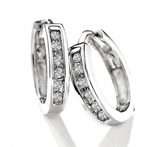  Diamond Huggie Hoop Earrings in 10K White Gold. Image via Peoples.