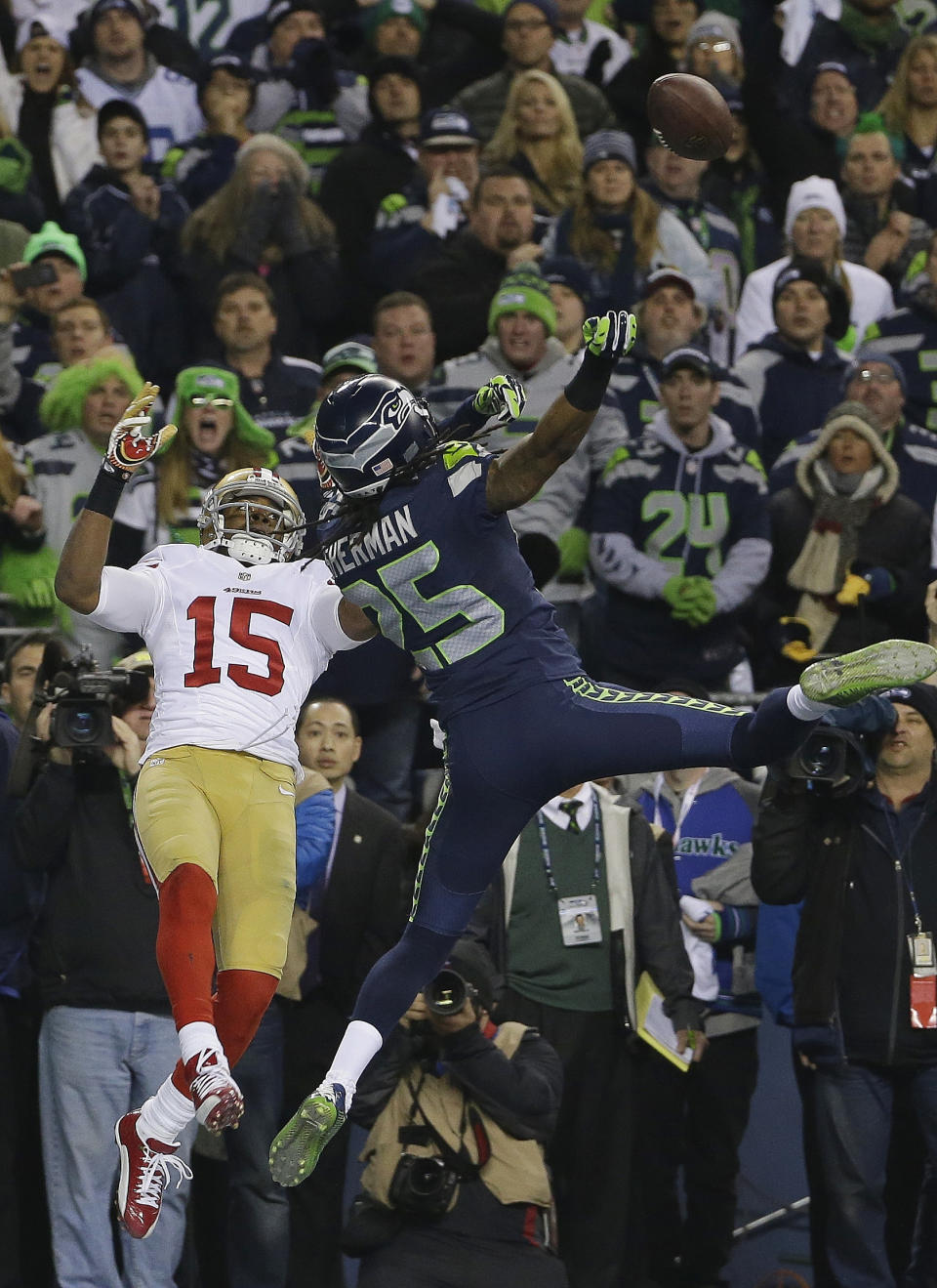 Seattle Seahawks' Richard Sherman tips a pass intended for San Francisco 49ers' Michael Crabtree (15) in the final seconds of the second half of the NFL football NFC Championship game Sunday, Jan. 19, 2014, in Seattle. Malcolm Smith intercepted the tipped pass. The Seahawks won 23-17 to advance to Super Bowl XLVIII. (AP Photo/Matt Slocum)