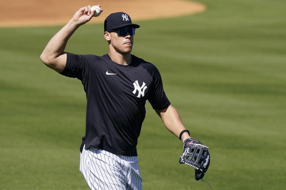 New York Yankees' Aaron Judge throws to a teammate during a spring training baseball workout, Tuesday, Feb. 23, 2021, in Tampa, Fla. (AP Photo/Frank Franklin II)