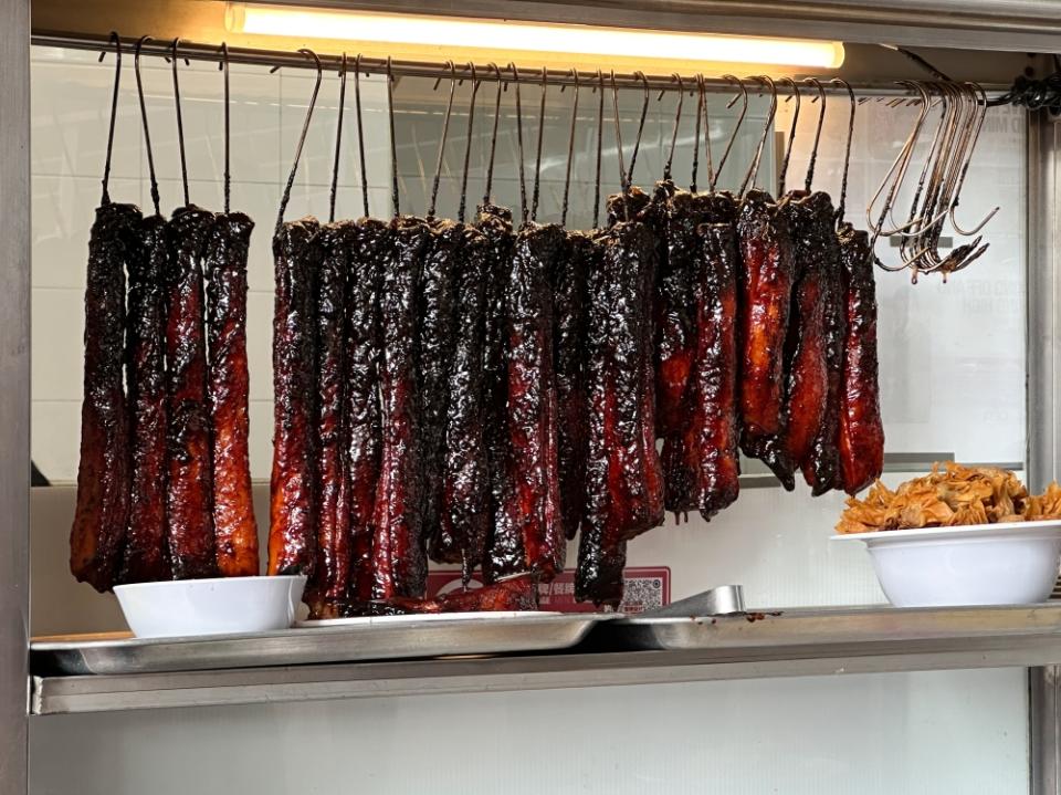 The glistening 'char siu' is ready to be chopped and served with noodles.