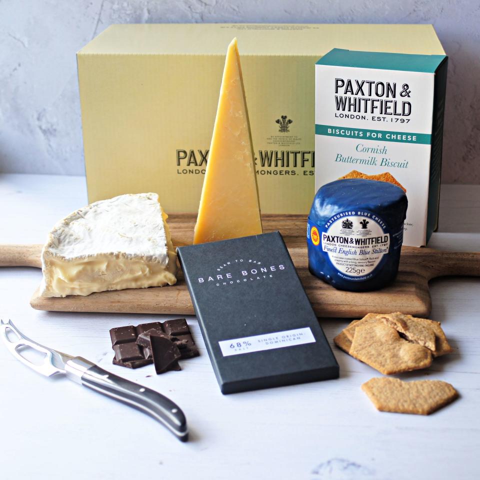 <p>A selection of British artisan cheeses, Cornish buttermilk biscuits and a bar of creamy salted chocolate to finish. </p><p><a class="link " href="https://www.paxtonandwhitfield.co.uk/shop/cheese-board-collections/fathers-day-cheese-chocs-gift?c=7" rel="nofollow noopener" target="_blank" data-ylk="slk:BUY NOW;elm:context_link;itc:0;sec:content-canvas">BUY NOW</a> £40, Paxton & Whitfield <br></p>